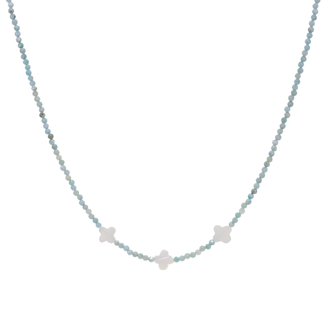 Necklace with small star-shaped pendants on a light blue beaded chain against a white background