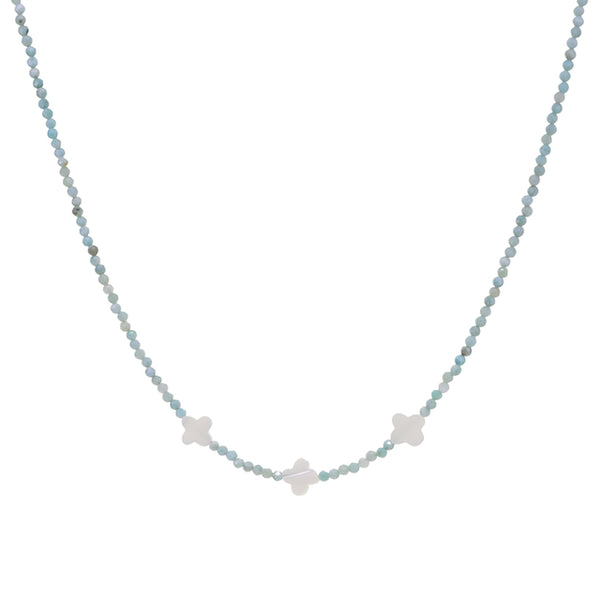 Necklace with small star-shaped pendants on a light blue beaded chain against a white background