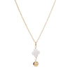 Gold necklace with a white pendant and gold ball on a white background