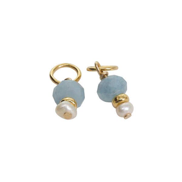 Pair of earrings with blue beads and gold accents on a white background