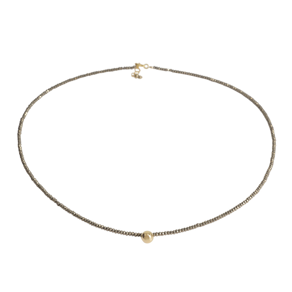 Necklace with a single pearl on a white background