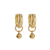 Gold hoop earrings with dangling balls on a white background