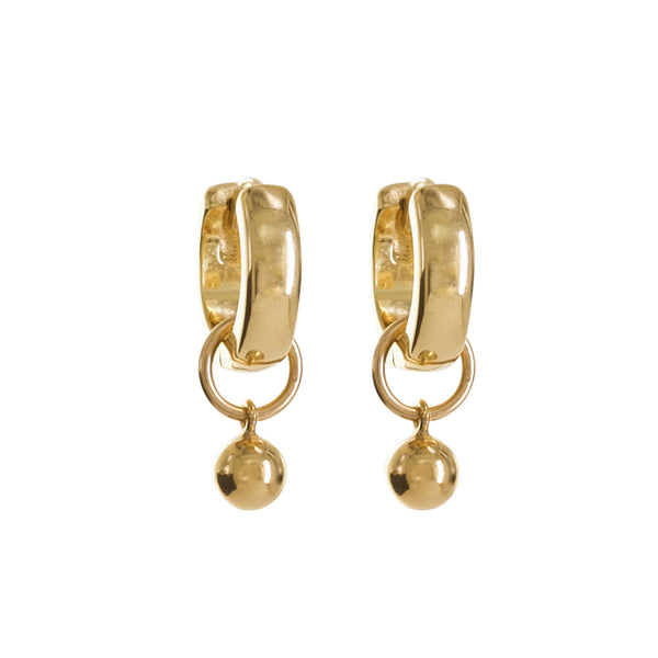 Gold hoop earrings with dangling balls on a white background