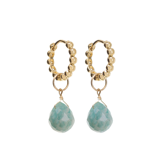 Gold hoop earrings with teal stone drops on a white background